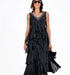 Elegant long black chiffon dress with thin straps, cascading ruffles, perfect for casual and evening events.